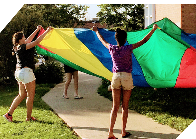 Youths playing with a parachute
