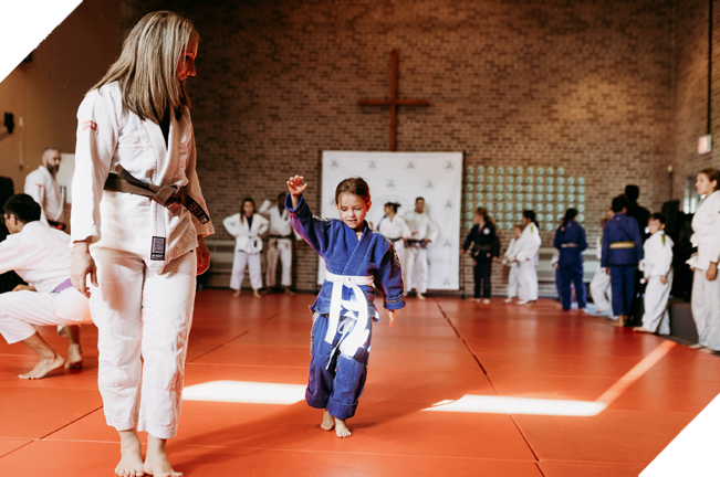 Young girl and female jiu jitsu teacher
